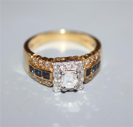A modern 18ct gold and diamond square cluster ring, with sapphire and diamond set shoulders, size M.